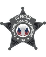 clothe patch with filmore guard services officer a grey star shaped badge with white text