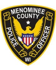 Patches and embroidery Menominee county police officer patch with a black and yellow patch with a white shield with a bird and text