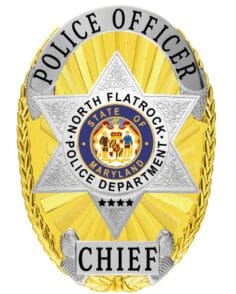 Police officer chief gold and silver police badge with black text and a star in the middle