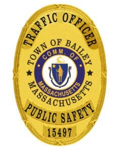 Police badge town of balley massachusetts a gold police badge with blue and yellow text