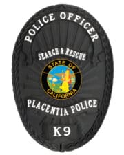 police badge k9 unit a black police badge with white text