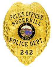 police badge with sugerhill police department a close-up of a police badge