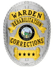 Rehabilitation Corrections Warden Silver Badge with black text and Idaho state seal. Style # 8-d13