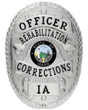 Rehabilitation Corrections Officer silver badge with black text and state of Idaho center seal. Style# 8-d13