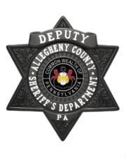 Deputy Sheriff badge a black star shaped badge with white text