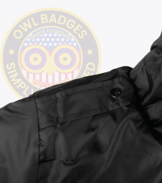 Performance Watch Guard Security Bomber Jacket Owl Badges Logo a close up of a black jacket