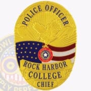 Personalized Police Badges: Do Personalized Badges Represent Law Enforcement Identity a yellow badge with a bird and a flag