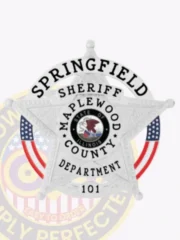 A custom metal badge in a polished silver color shaped like a star, representing law enforcement. The badge features the text "SPRINGFIELD" at the top, "SHERIFF" below, and "MAPLEWOOD COUNTY" along its edges. In the center, it showcases the state seal of Illinois, surrounded by red and white stripes. It is designed with a safety pin attachment on the back, allowing for secure wearing while highlighting service and authority.